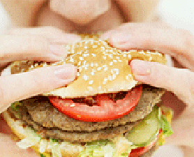 Man eating hamburger. Asthma and diet link