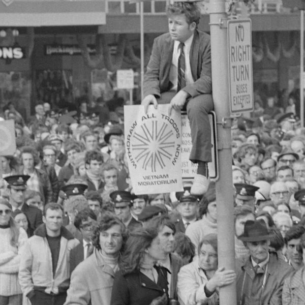 a black and white historical photograph of crowds and posters during a protest - Saturday 9 May 2026