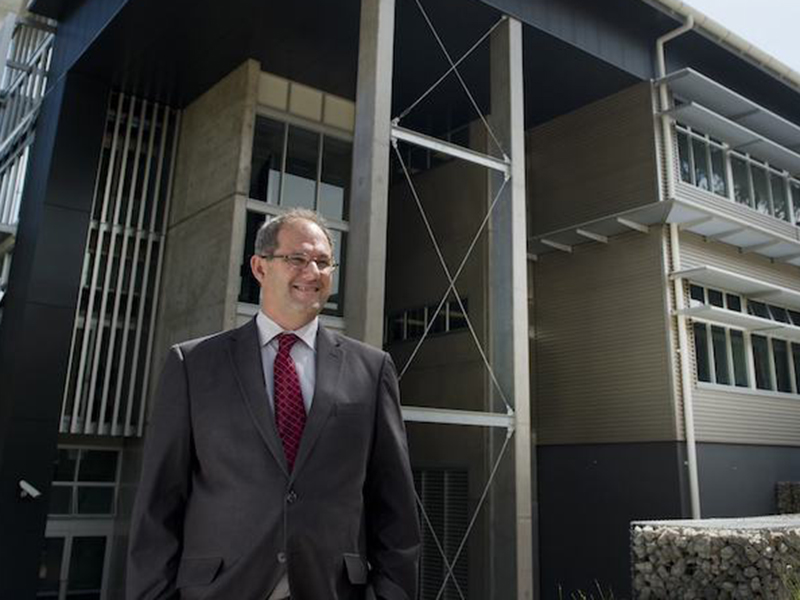 Alan Broadfoot smiling in front of NIER building
