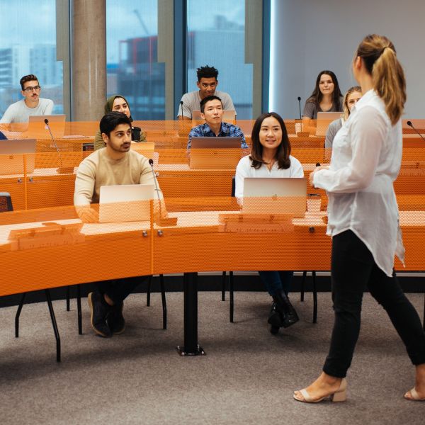 A lecturer speaks to a class full of students. National University Teaching Awards celebrate exceptional University of Newcastle educators