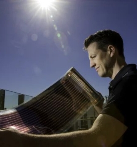 Scientist holding Solar panels