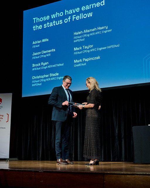 Adrian Wills receives EA Fellowship Award on stage