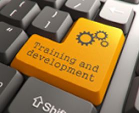 'Training and development' printed on computer keyboard. Workshops for researchers