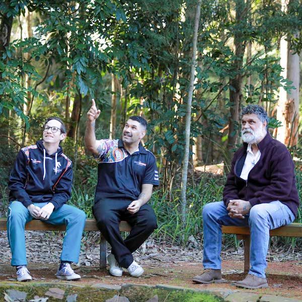 r Raymond Kelly, right, says language gives Indigenous people a sense of identity, connection and belonging. Dr Kelly is pictured with first year medical student David Parsons, left, and Wollotuka Institute project officer Kua Swan, centre..  The benefits of speaking in an Aboriginal Language