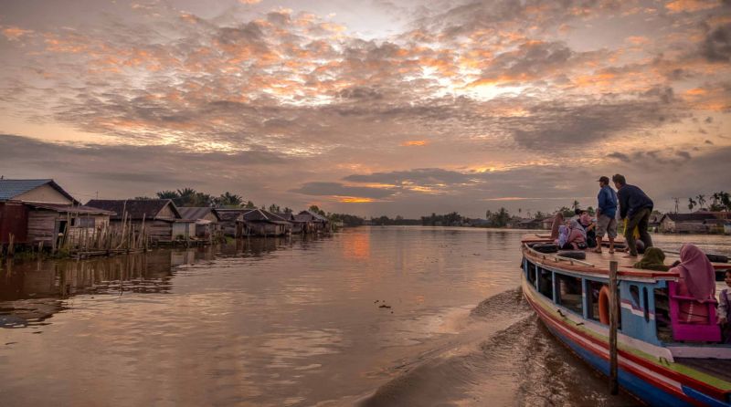 Boat on the water at sunset